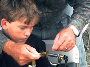 Bill Wofford helping an interested  youngster.