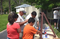 A family prepares to try the knot strength test machine