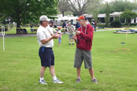 Terry Blackwell helps a young caster